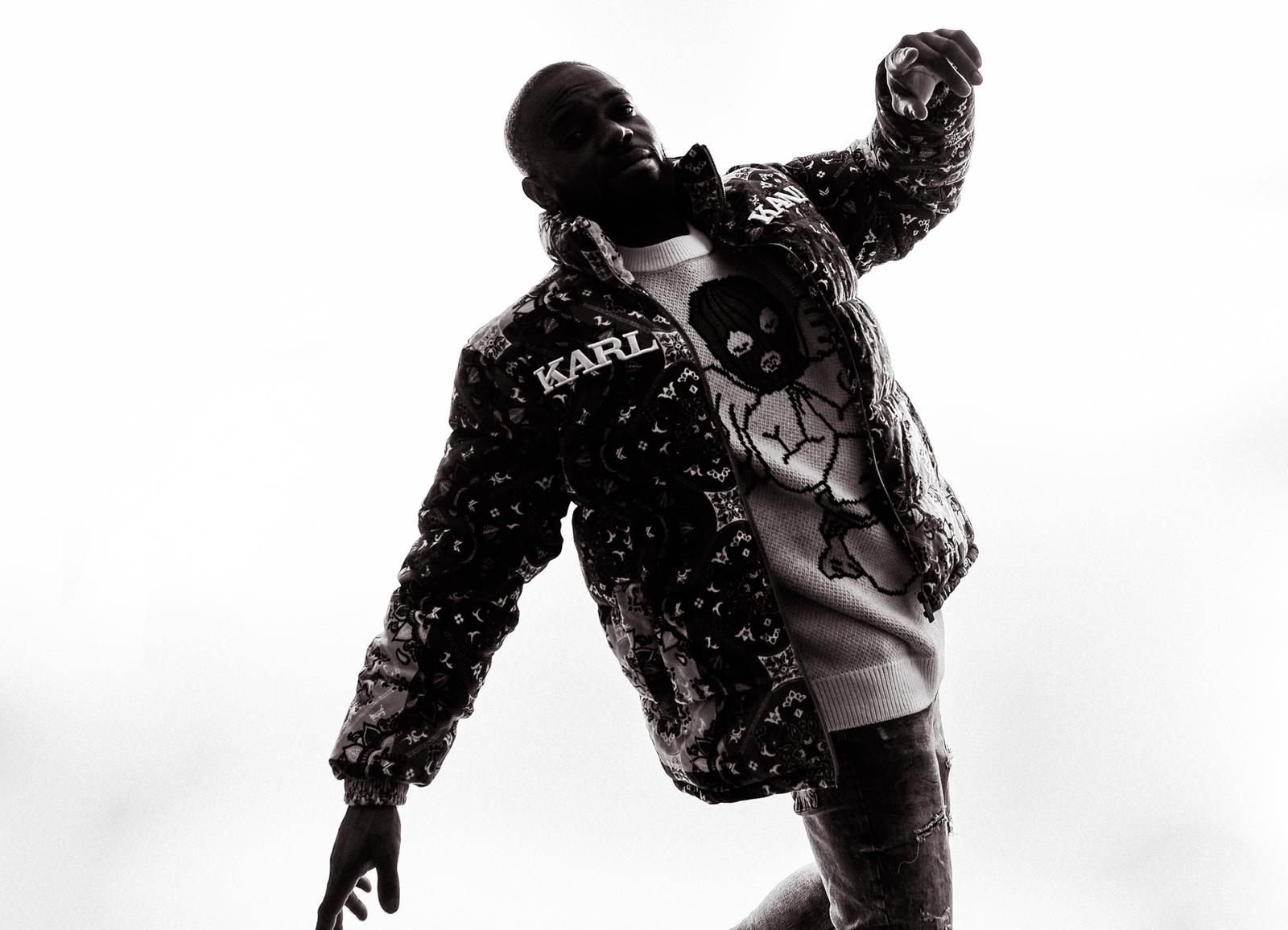 GallantTyno in motion wearing patterned bandana jacket